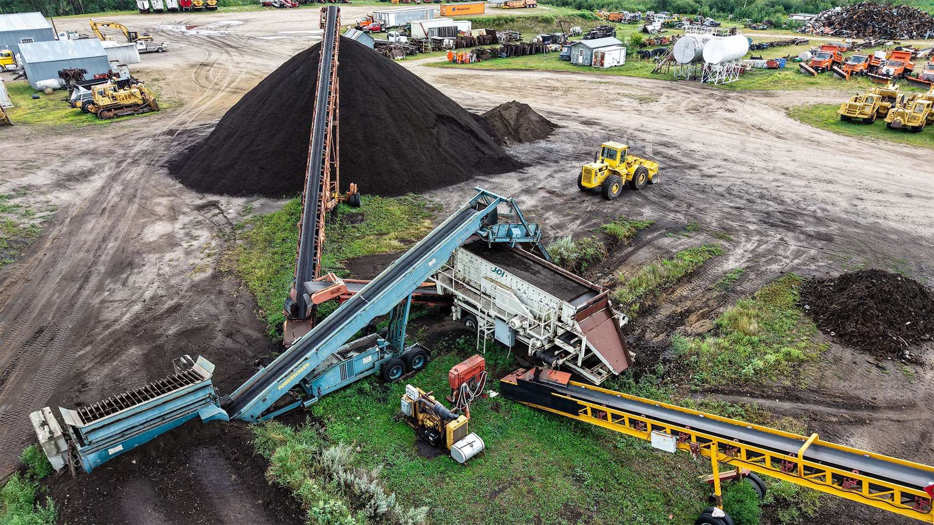 Storlie screening plant separating rock and roots from black dirt