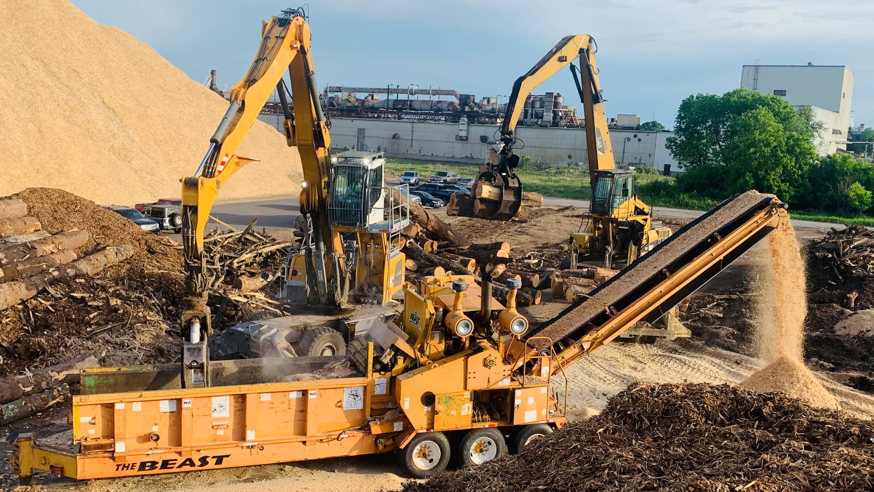 Storlie excavators and aggregate-processing equipment working together