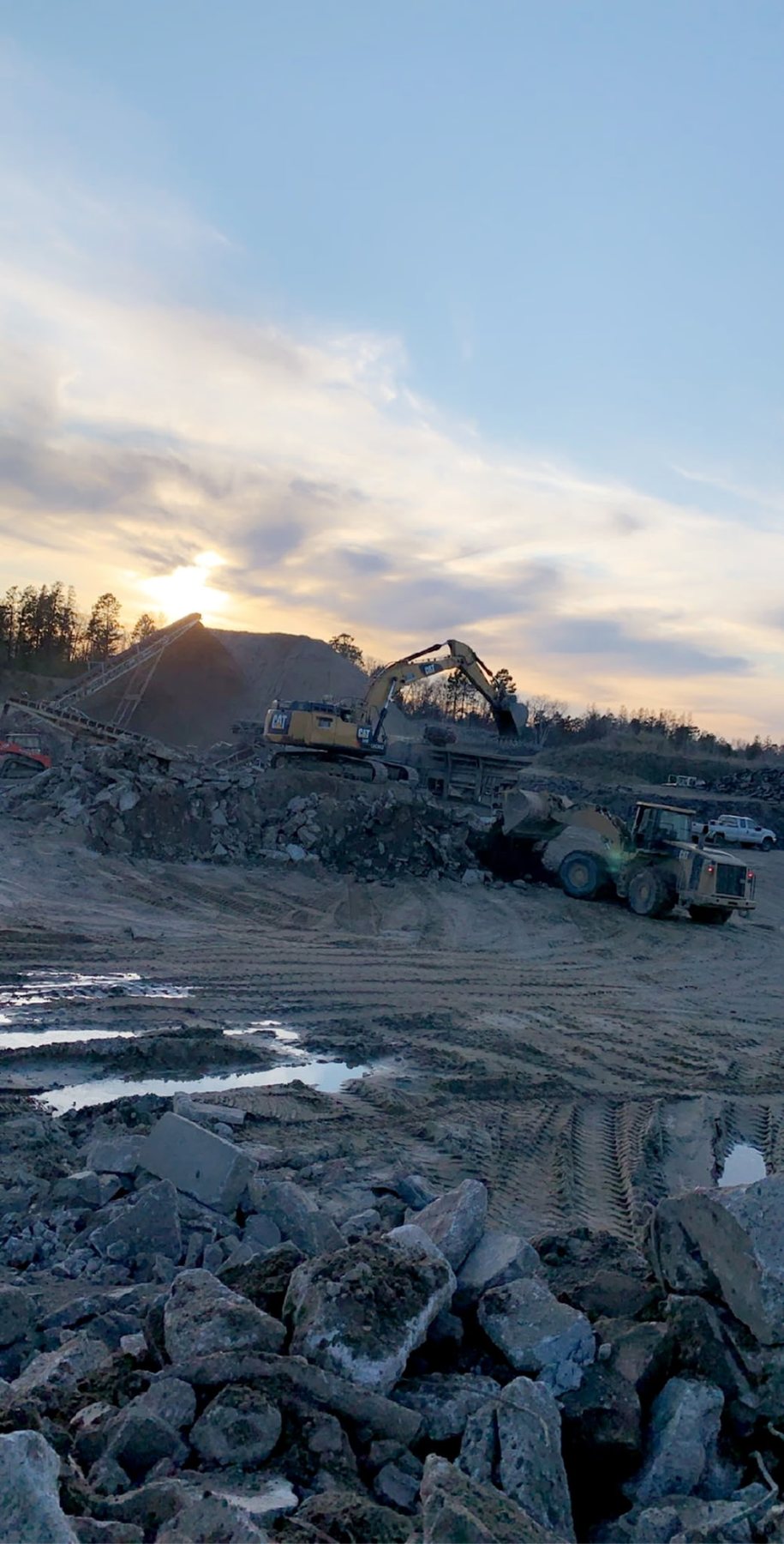 Excavation and aggregate work continuing at sunset