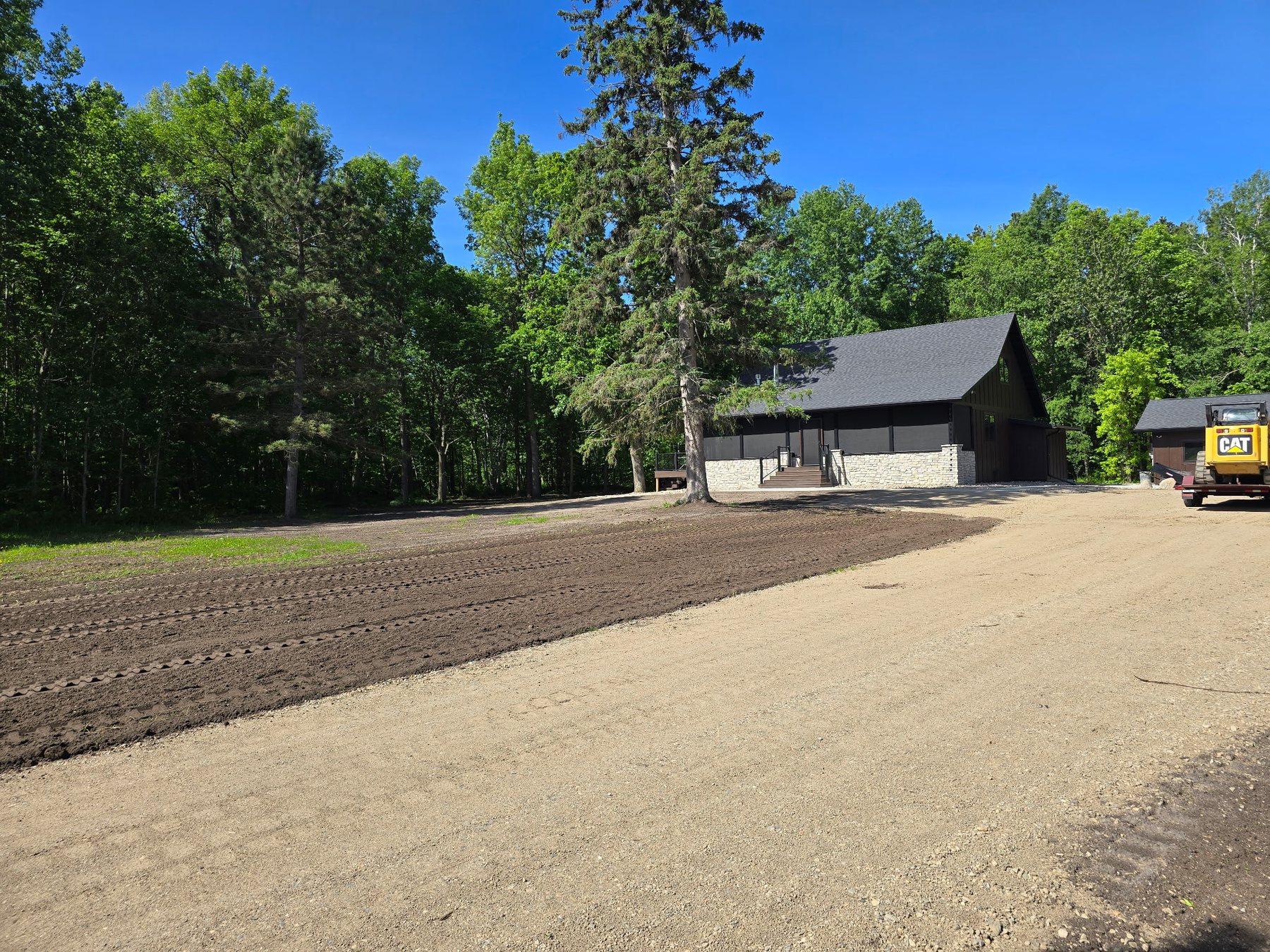 Finished stone landscaping and grading beside a home