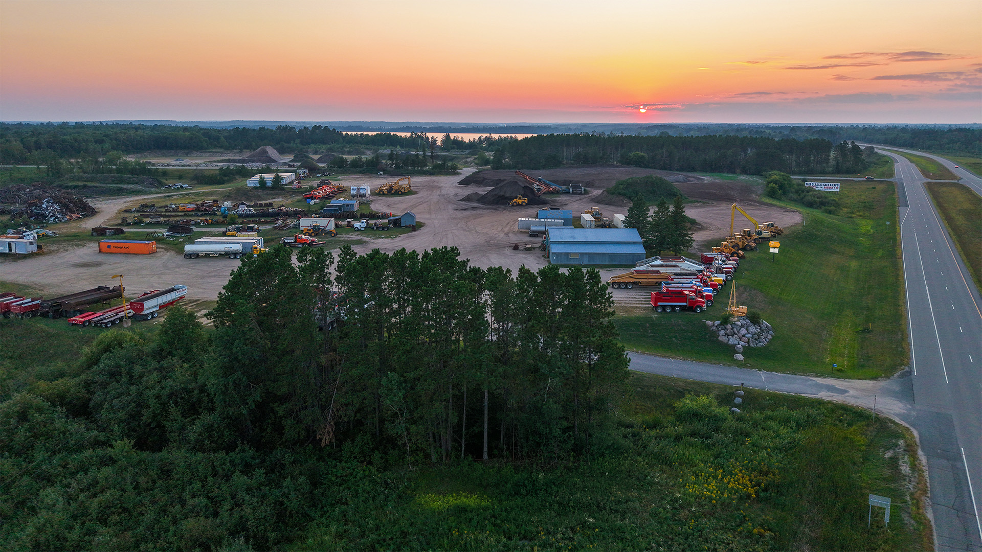 Aerial view of a Storlie Construction gravel pit at sunset near Cass Lake