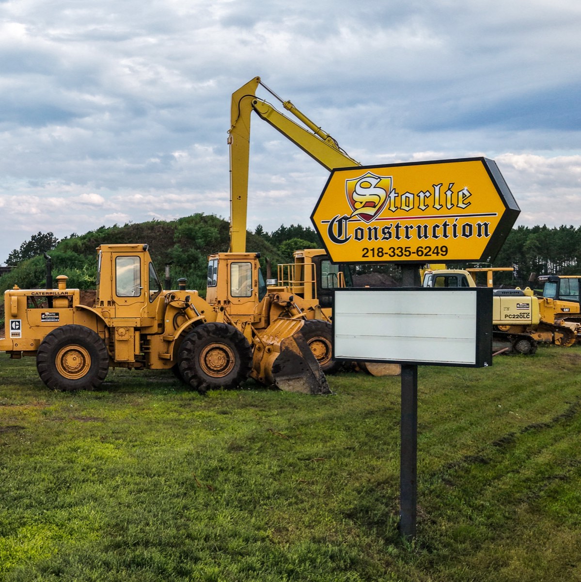 Storlie excavators and equipment lineup, including the long-reach excavator