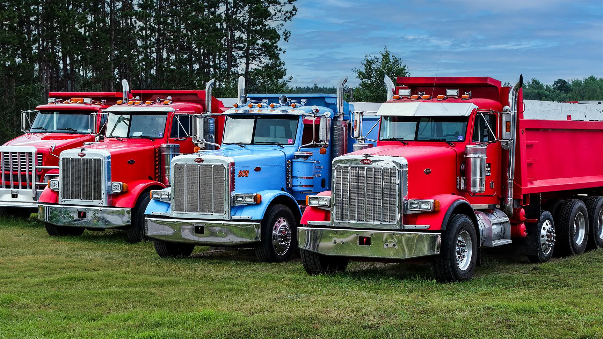 Storlie tandem dump trucks lined up ready for delivery